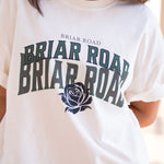 Close up of white oversized woman's crewneck with Briar Road branding