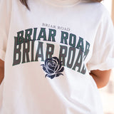 Close up of white oversized woman's crewneck with Briar Road branding