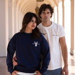 Woman wearing navy blue long sleeved crewneck and man wearing white crewneck tshirt