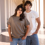 Man wearing varsity crewneck and woman wearing oversized crewneck