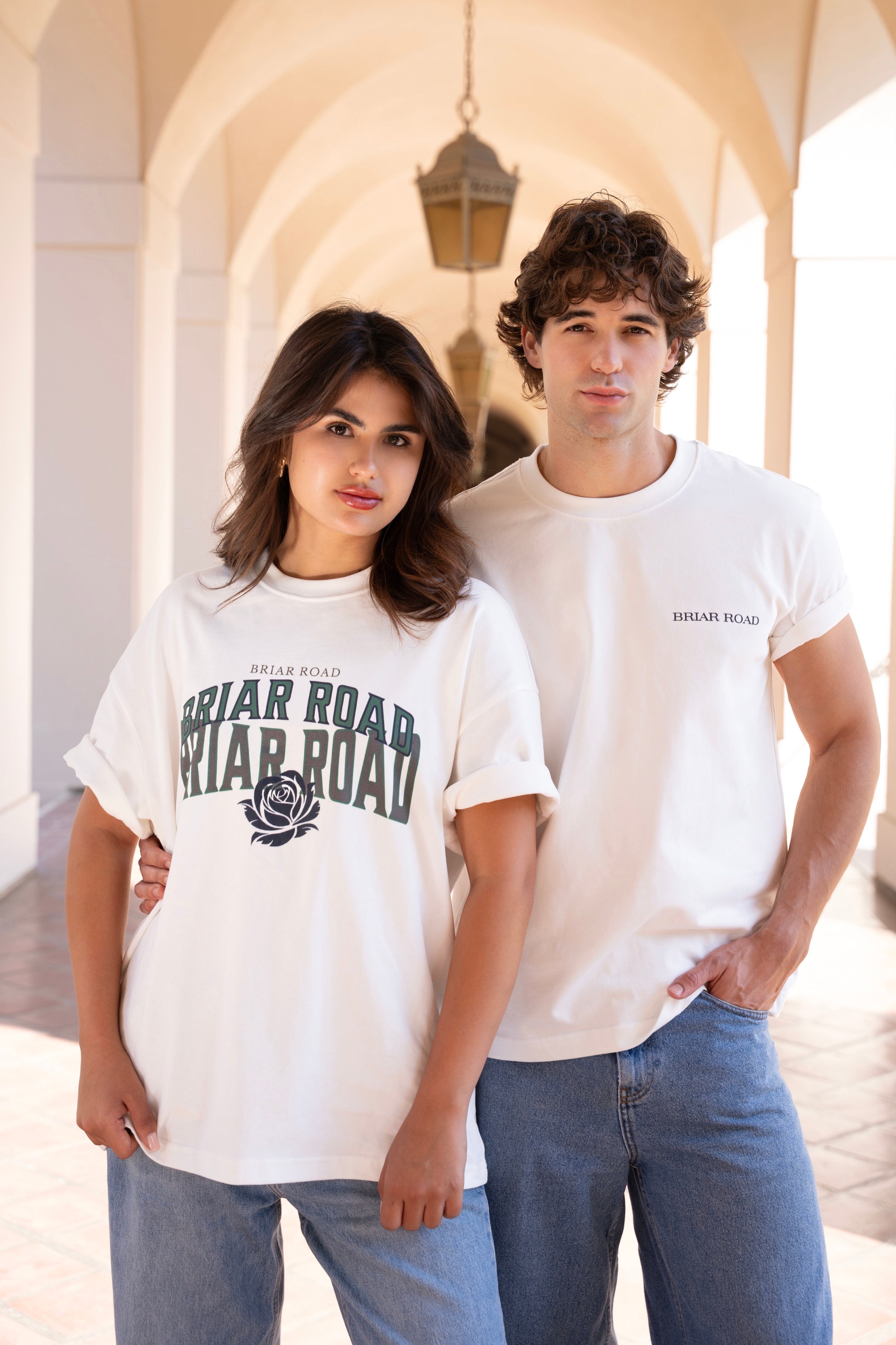 Couple posing both wearing white crewnecks