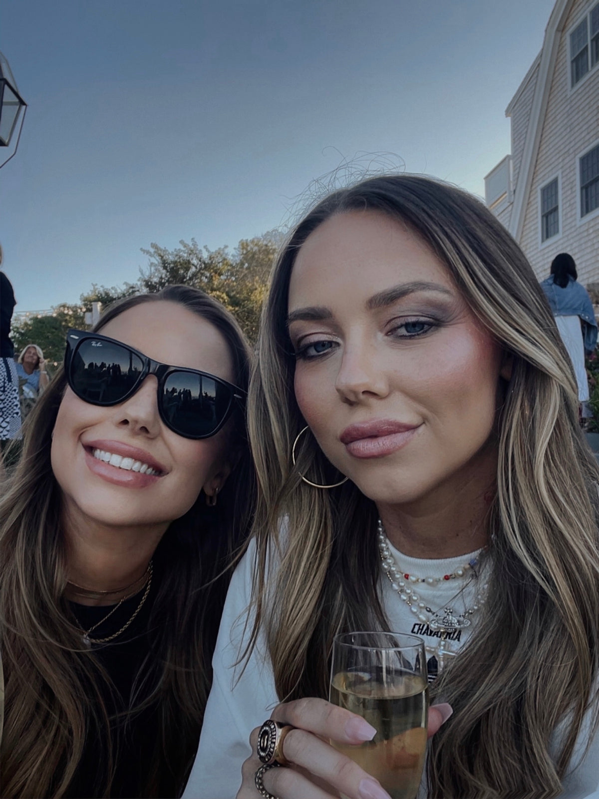 Candid photo of Briar Road founders outdoors sharing a relaxed moment, highlighting sisterhood, storytelling, and intentional living.